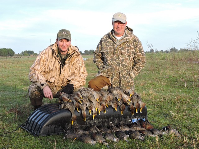 Father and son duck hunting Argentina